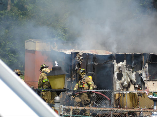 Firefighters working the Trailer Fire on Dutchess Drive on June 19, 2008.